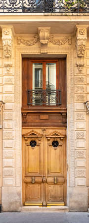 Paris, an ancient door, typical building in the 11e arrondissementの写真素材