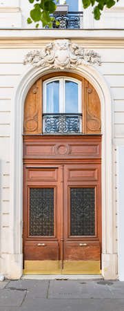 Paris, an ancient door, typical building in the 11e arrondissementの写真素材