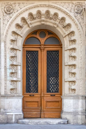Paris, an ancient door, typical building in the 11e arrondissementの写真素材