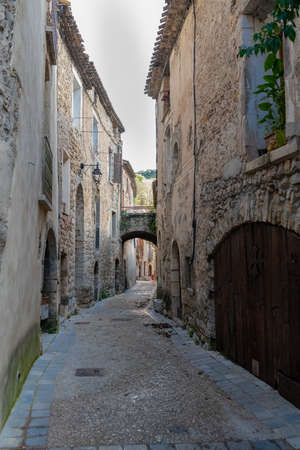 Saint-Guilhem-le-Desert in France, view of the village, typical street and housesの写真素材