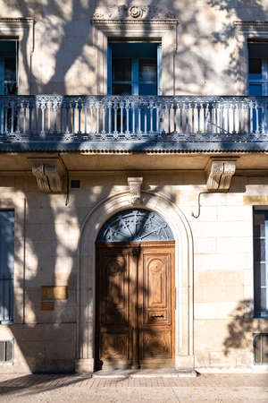 Nimes in Franc, old facades in the historic center, beautiful wooden doorの写真素材