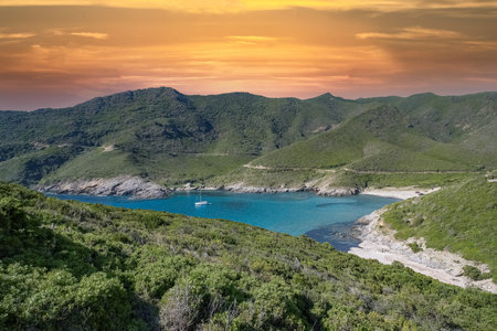 Corsica, seascape in the cap Corse, a beautiful creek with a boat, transparent water,  in summerの写真素材