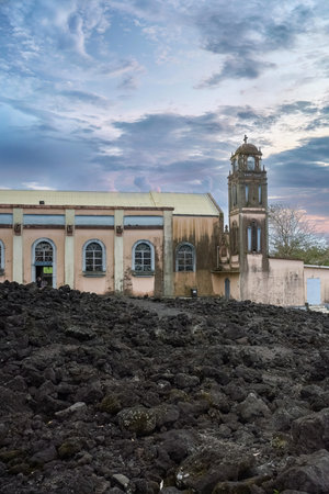La Reunion, the Notre-Dame-des-Laves church in the village of Sainte-Rose, with the lava around, in the east coast of the islandの写真素材