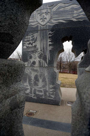 Quebec, Canada -12-02-2021: commemorative monument representing Jacques Cartier and Grand Chief Donnacona de StadaconÃ© at Cartier-BrÃ©beuf National Historic Site of Canada in Quebec Cityのeditorial素材