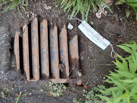 A sewer grate in townの写真素材