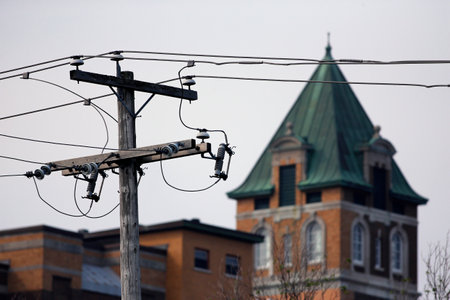 an electric pole in townの写真素材