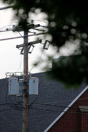 an electric pole in townの写真素材
