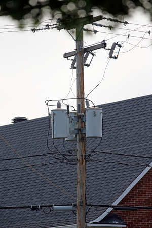 an electric pole in townの写真素材