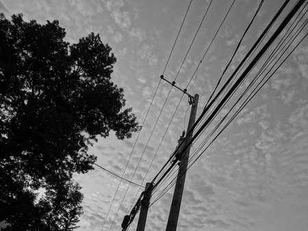 an electric pole in townの写真素材