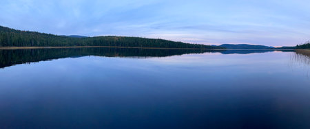 a lake in the forest in autumnの写真素材