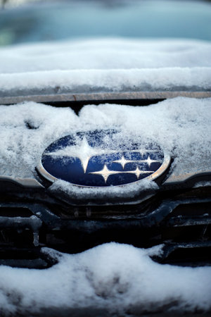 The logo of a Subaru Forester in winter