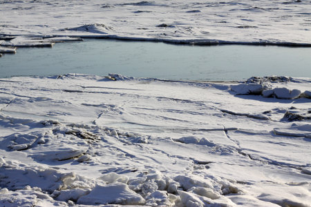 detail of the ice on the frozen river in winter