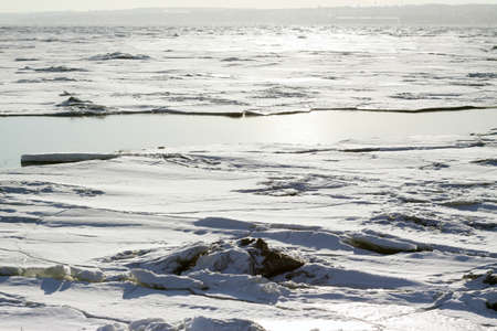detail of the ice on the frozen river in winterの写真素材