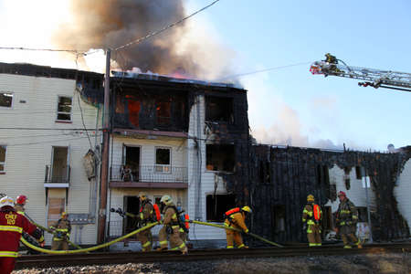 Firefighters at work during a fire in a buildingのeditorial素材