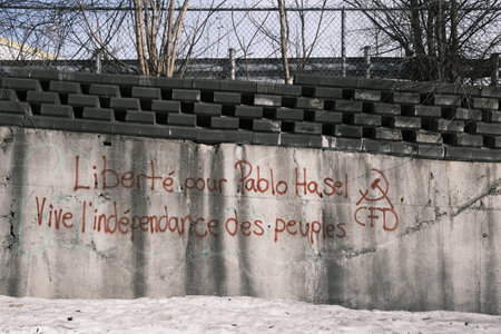 The inscription on the wall of an abandoned building. Graffiti to free the artist Pablo HasÃ©l.のeditorial素材
