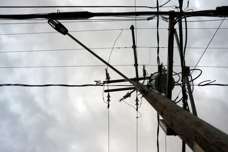 an electric pole in townの写真素材