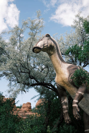 Reconstruction of a dinosaur in the forest at the Calgary Zooの写真素材