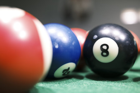 Billiard balls on a green table with shallow depth of field.の写真素材