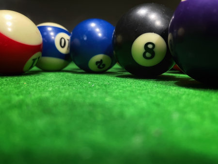 Billiard balls on green table. Selective focus and shallow depth of field.の写真素材