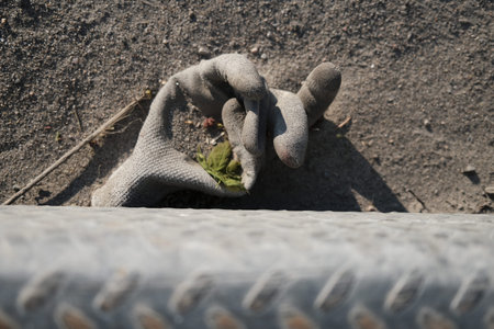 an old glove abandoned on the ground at a construction site