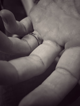 Wedding ring on a hand. Black and white photo.の写真素材