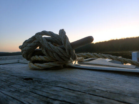 Rope on the deck of a sailing boat, closeup of photo