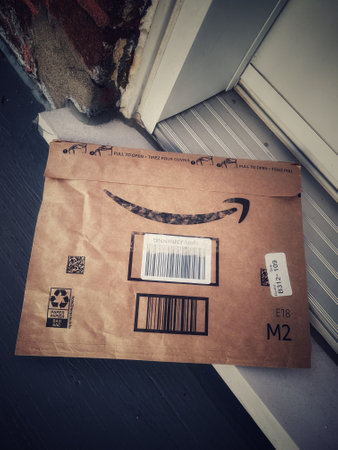 Close-up of an Amazon box being delivered outsideのeditorial素材