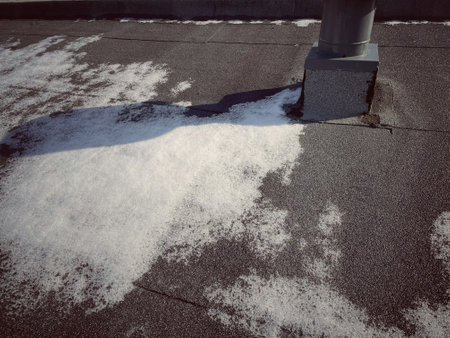 snow on the roof of the house in winter. close-upの写真素材