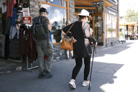 Banff, Alberta, Canada. Tourists visiting downtown on Banff Avenueのeditorial素材