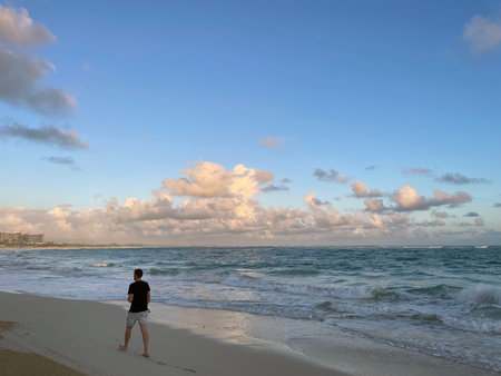 Man on the beach at sunset, Punta Cana.の写真素材