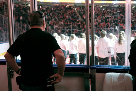 A sound manager during a show in an arena. View from the rear.の写真素材