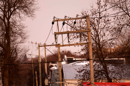 Power line on the city street in the early spring. Selective focus.