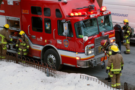 Firefighters at the scene of a fire in the city center.のeditorial素材