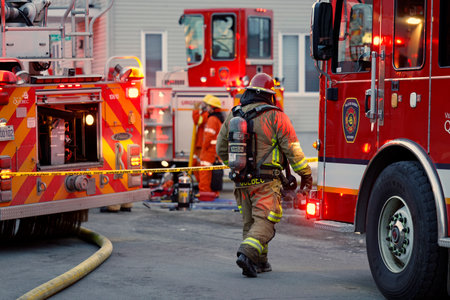 Firemen in action during a training session in the fire department.のeditorial素材