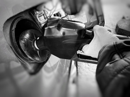 Detail of a car being refilled at a gas station.の写真素材