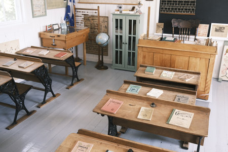 Interior of an old school classroom with wooden desks and chairs. Interior of an old rural school in Quebec.のeditorial素材