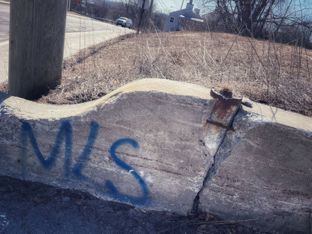 Concrete slab in the street with graffiti on itの写真素材