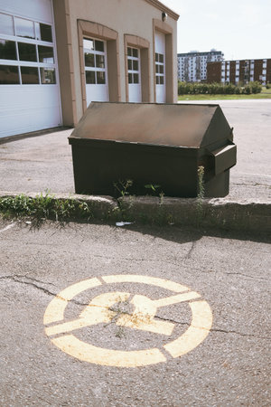 Garbage bin in a parking lotの写真素材