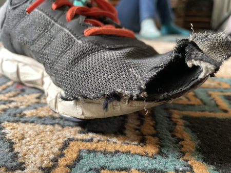 Sneakers on a carpet, closeup of photo with selective focusの写真素材