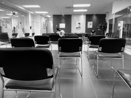 Chairs in a waiting room of a medical clinic. Black and white image. Selective focus.