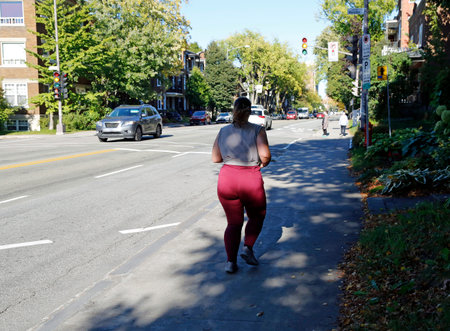 Woman running on a street in Quebec city