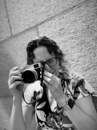 Woman with a camera in her hands. Black and white photos.