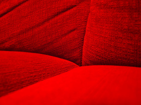 Red sofa texture close-up. Abstract background and texture for design.の写真素材