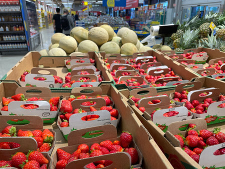 Strawberries in boxes at a fruit and vegetable section of a supermarketのeditorial素材