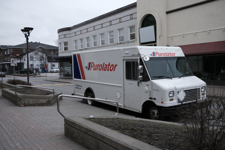 A Purolator International delivery truck on the streetのeditorial素材