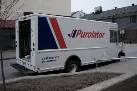 A Purolator International delivery truck on the streetのeditorial素材