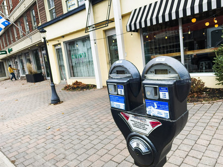 Parking meter at the entrance of a business in Rimouski, Quebec.のeditorial素材