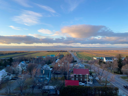 Aerial view of rural area with houses and road at sunset.の写真素材