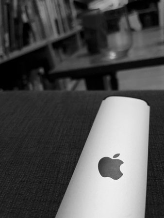 Black and white image of a remote control for Apple TV.のeditorial素材