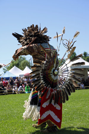 A Native American in traditional costume at the annual festival